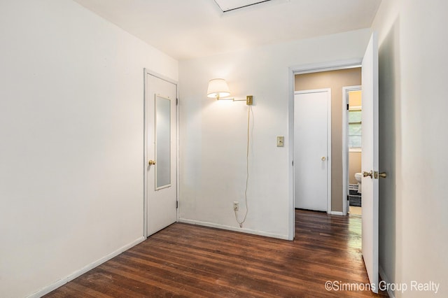 252 Jeffrey St, Cedar Springs, MI 49319 - unfurnished bedroom featuring dark wood-style flooring and baseboards