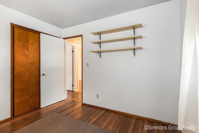 252 Jeffrey St, Cedar Springs, MI 49319 - unfurnished bedroom with wood finished floors and baseboards
