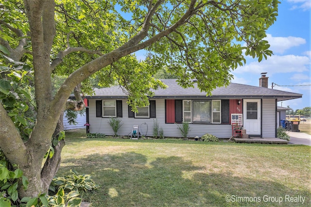 252 Jeffrey St, Cedar Springs, MI 49319 - view of front facade featuring a front lawn, roof with shingles, and a chimney