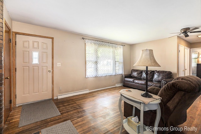 252 Jeffrey St, Cedar Springs, MI 49319 - living area with a baseboard heating unit, wood finished floors, and ceiling fan