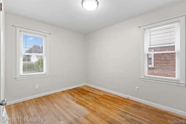 22951 Audette, Dearborn, MI 48124 - spare room featuring baseboards and light wood finished floors