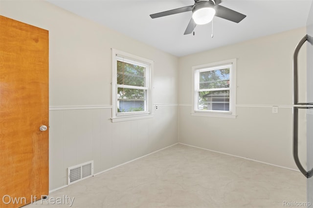22951 Audette, Dearborn, MI 48124 - unfurnished bedroom with a wainscoted wall and a ceiling fan