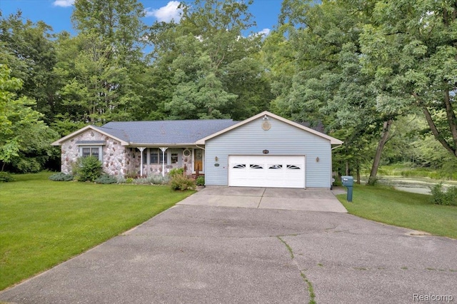 1829 Farnsworth Rd, Lapeer, MI 48446 - ranch-style home featuring asphalt driveway, a garage, a front lawn, and stone siding