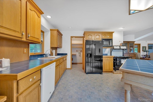 1829 Farnsworth Rd, Lapeer, MI 48446 - kitchen with black refrigerator with ice dispenser, dishwasher, tile countertops, and recessed lighting