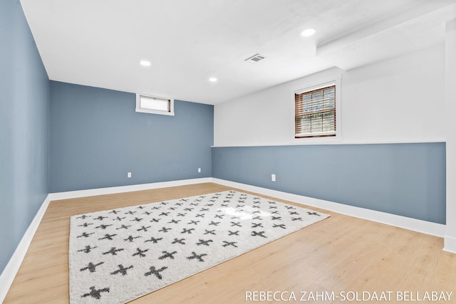 3520 Auburn Ave NE, Grand Rapids, MI 49525 - below grade area with wood finished floors, recessed lighting, and plenty of natural light