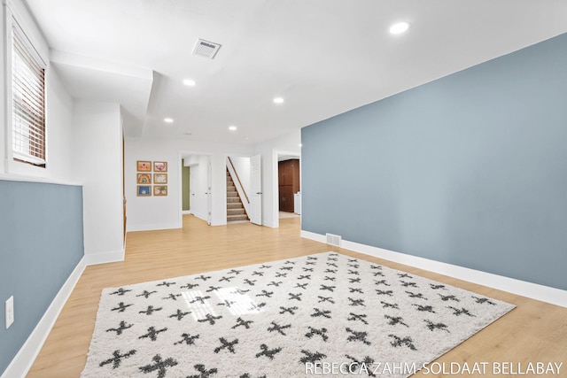 3520 Auburn Ave NE, Grand Rapids, MI 49525 - unfurnished room with stairway, light wood-style floors, and recessed lighting