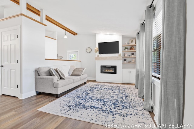 3520 Auburn Ave NE, Grand Rapids, MI 49525 - living room with a glass covered fireplace and wood finished floors