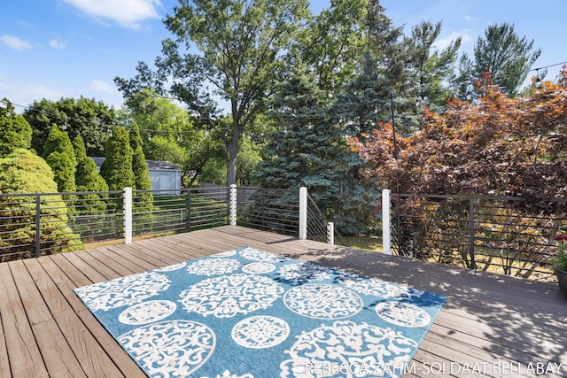 3520 Auburn Ave NE, Grand Rapids, MI 49525 - deck featuring a storage unit and view of scattered trees