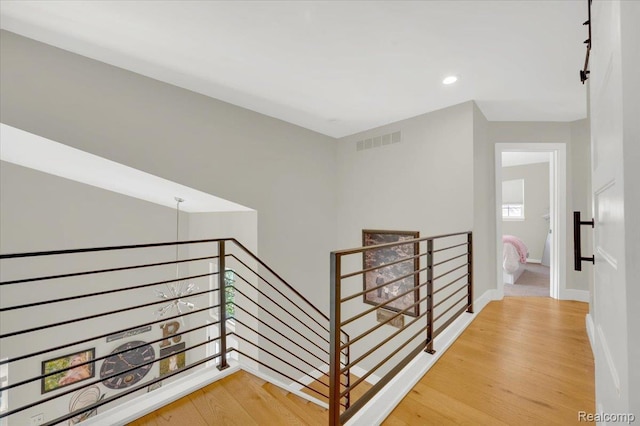5612 Northcrest Xing, Clarkston, MI 48346 - stairs with wood finished floors and recessed lighting