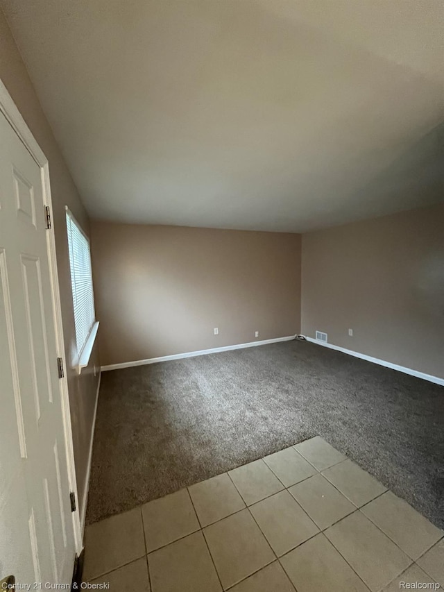 6179 Sylvia St, Taylor, MI 48180 - empty room featuring carpet and tile patterned flooring