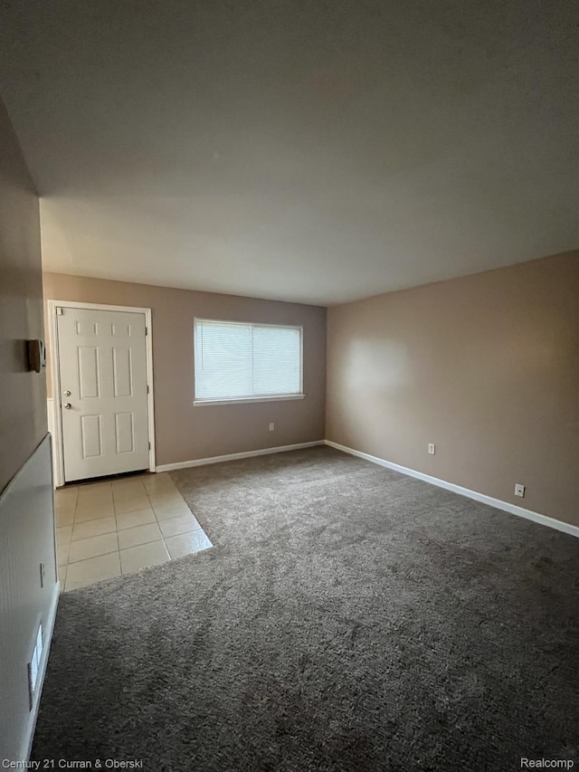 6179 Sylvia St, Taylor, MI 48180 - carpeted empty room with tile patterned floors and baseboards