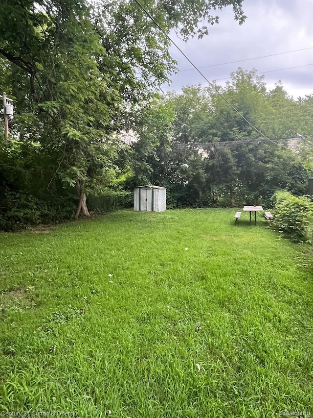 6179 Sylvia St, Taylor, MI 48180 - view of green lawn with a storage unit