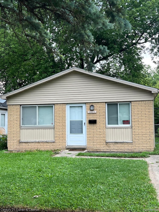 6179 Sylvia St, Taylor, MI 48180 - view of front of property with brick siding and a front yard