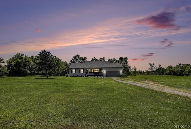 2866 Graham Rd, Imlay City, MI 48444 - ranch-style house with driveway, a garage, and a front yard