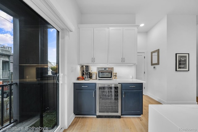2037 11th St Unit 3, Detroit, MI 48216 - indoor wet bar with wine cooler, light wood finished floors, recessed lighting, and tasteful backsplash