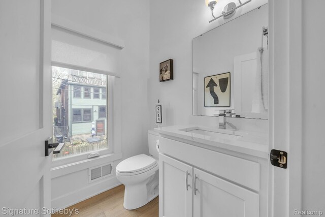 2037 11th St Unit 3, Detroit, MI 48216 - half bath featuring vanity and wood finished floors