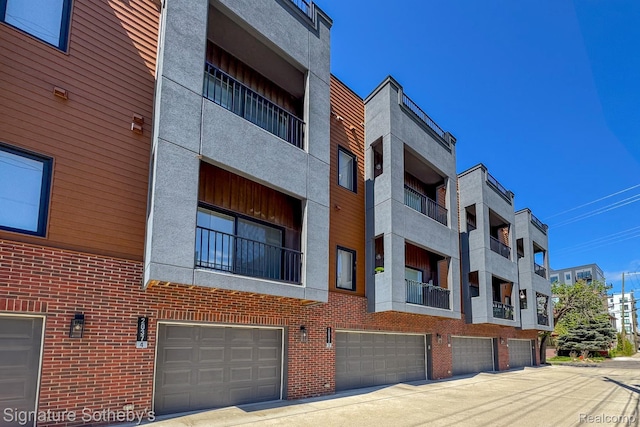 2037 11th St Unit 3, Detroit, MI 48216 - view of building exterior featuring an attached garage