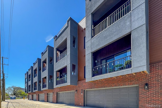 2037 11th St Unit 3, Detroit, MI 48216 - view of building exterior featuring an attached garage