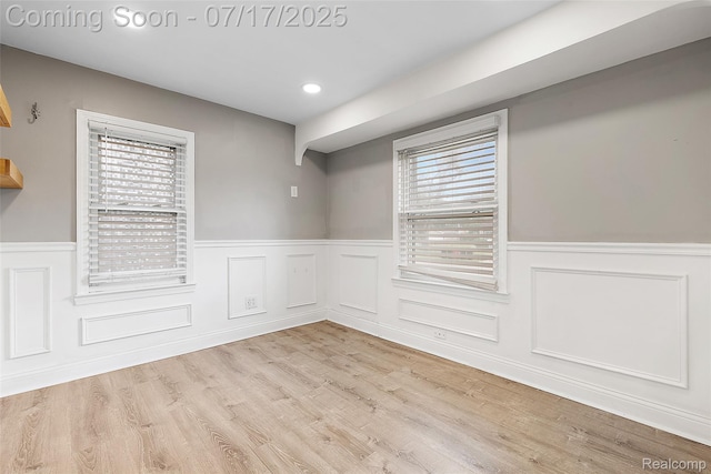 5869 Marvin St, Taylor, MI 48180 - spare room featuring wainscoting, healthy amount of natural light, wood finished floors, and recessed lighting