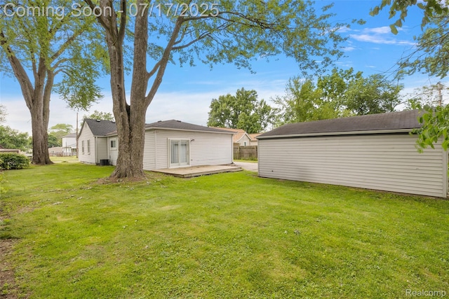 5869 Marvin St, Taylor, MI 48180 - view of green lawn featuring a wooden deck