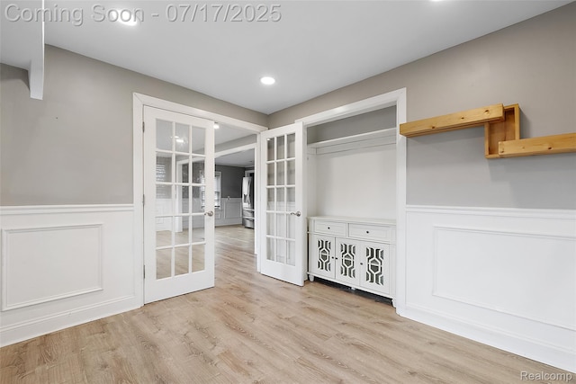 5869 Marvin St, Taylor, MI 48180 - unfurnished dining area featuring french doors, a wainscoted wall, recessed lighting, light wood-type flooring, and a decorative wall