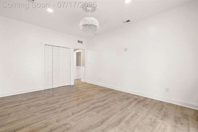 5869 Marvin St, Taylor, MI 48180 - unfurnished bedroom featuring light wood-style floors, recessed lighting, a closet, and a chandelier