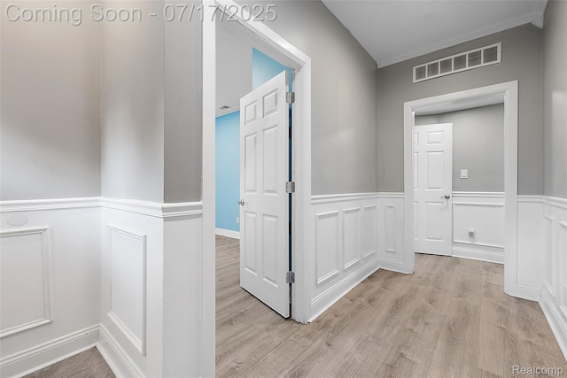 5869 Marvin St, Taylor, MI 48180 - hall featuring wainscoting, light wood-type flooring, and a decorative wall