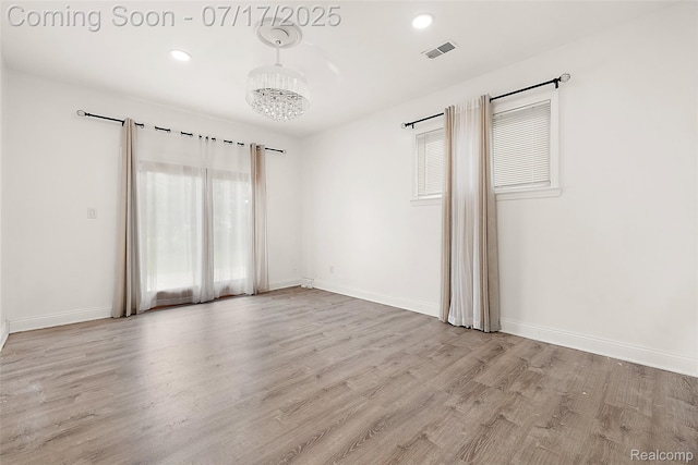 5869 Marvin St, Taylor, MI 48180 - unfurnished bedroom with a chandelier, wood finished floors, and recessed lighting