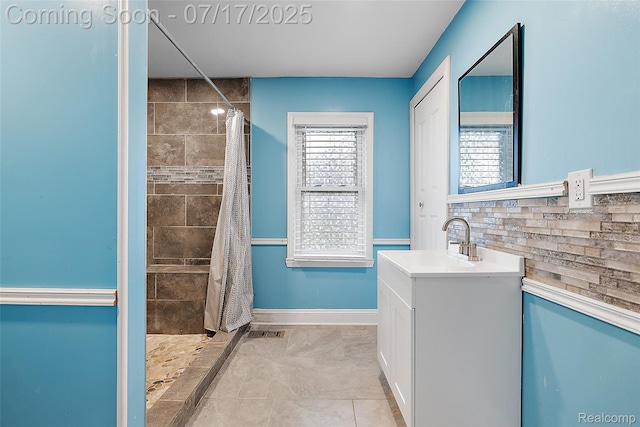5869 Marvin St, Taylor, MI 48180 - bathroom featuring vanity, a tile shower, and tasteful backsplash