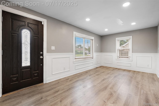 5869 Marvin St, Taylor, MI 48180 - foyer with a wainscoted wall, plenty of natural light, recessed lighting, light wood finished floors, and a decorative wall