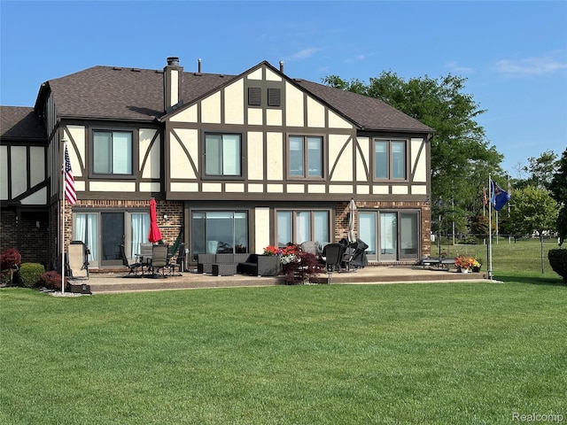 104 Lac Sainte Claire Dr, Saint Clair Shores, MI 48082 - back of property with a patio area, a yard, stucco siding, and a shingled roof