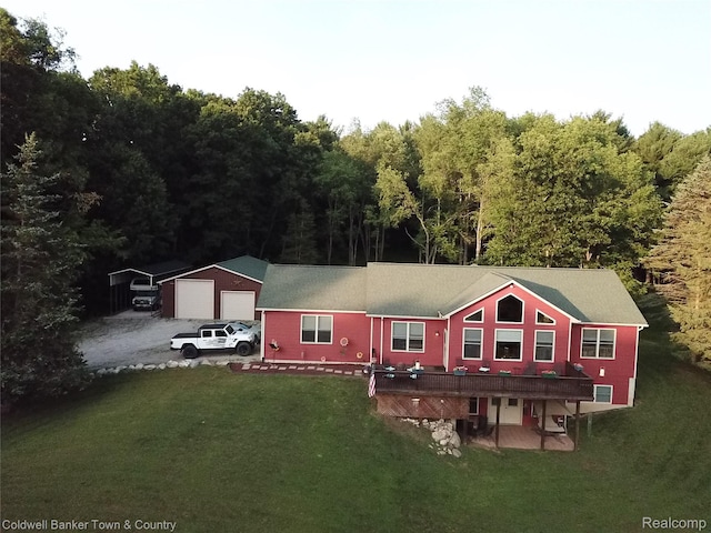 2223 Hidden Valley Rd, Howell, MI 48843 - view of front of property with a front yard, a detached garage, a wooden deck, and a carport