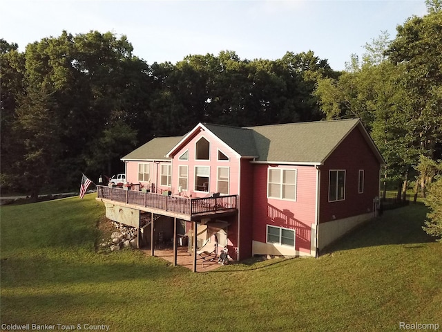 2223 Hidden Valley Rd, Howell, MI 48843 - rear view of property with a deck and a yard