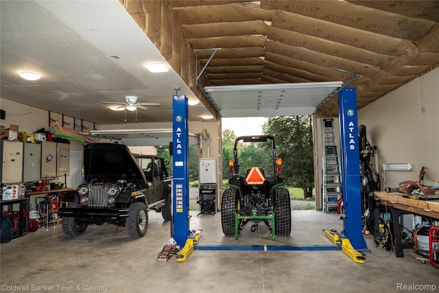 2223 Hidden Valley Rd, Howell, MI 48843 - garage with a workshop area and ceiling fan