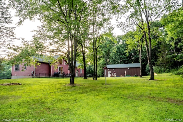 2223 Hidden Valley Rd, Howell, MI 48843 - view of grassy yard featuring an outdoor structure