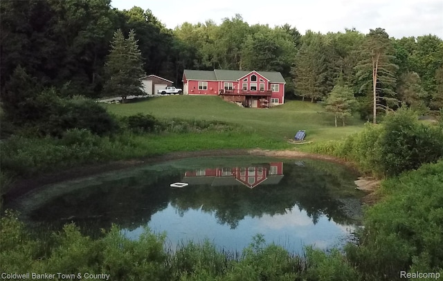 2223 Hidden Valley Rd, Howell, MI 48843 - view of subject property with a forest and a nearby body of water