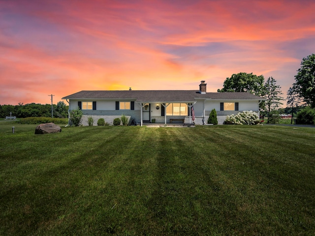 1140 Wing Dr, Ann Arbor, MI 48103 - ranch-style house featuring a chimney and a lawn