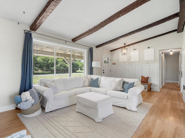 1140 Wing Dr, Ann Arbor, MI 48103 - living area with light wood-type flooring, beam ceiling, and wainscoting