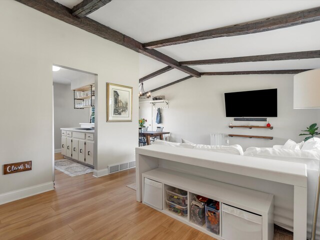 1140 Wing Dr, Ann Arbor, MI 48103 - living area with light wood-style flooring and baseboards