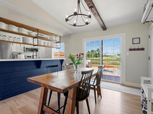 1140 Wing Dr, Ann Arbor, MI 48103 - dining space featuring a chandelier and light wood-style floors
