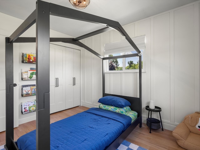 1140 Wing Dr, Ann Arbor, MI 48103 - bedroom with wood finished floors and a decorative wall