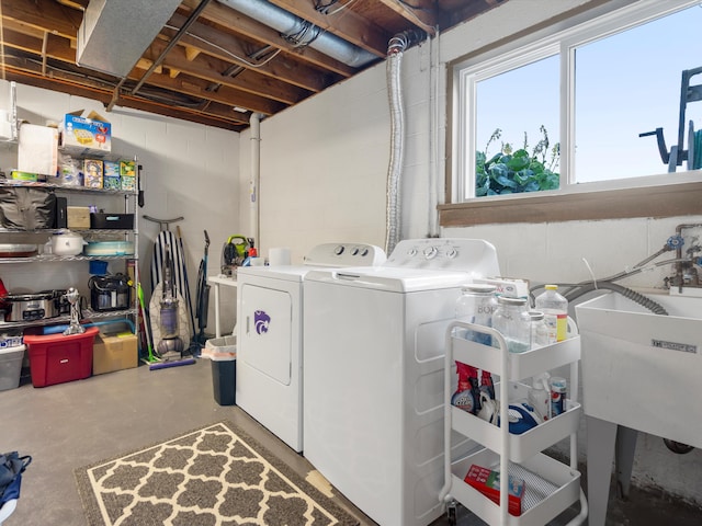 1140 Wing Dr, Ann Arbor, MI 48103 - laundry area featuring washing machine and dryer and concrete block wall