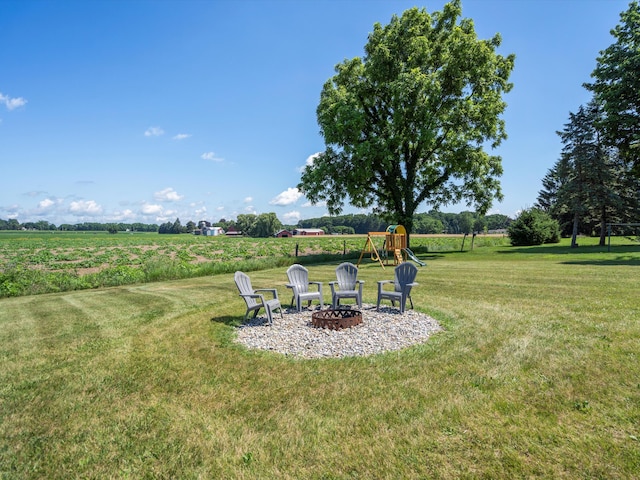 1140 Wing Dr, Ann Arbor, MI 48103 - view of green lawn featuring a playground, a view of rural / pastoral area, and a fire pit