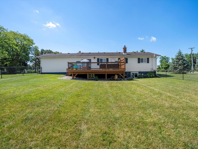1140 Wing Dr, Ann Arbor, MI 48103 - back of property featuring a deck and a chimney