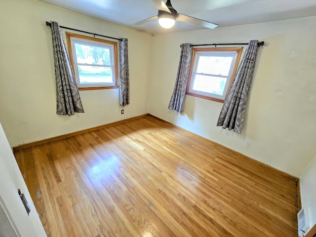 27751 Palomino Ave, Warren, MI 48093 - spare room featuring healthy amount of natural light, light wood-style flooring, and ceiling fan