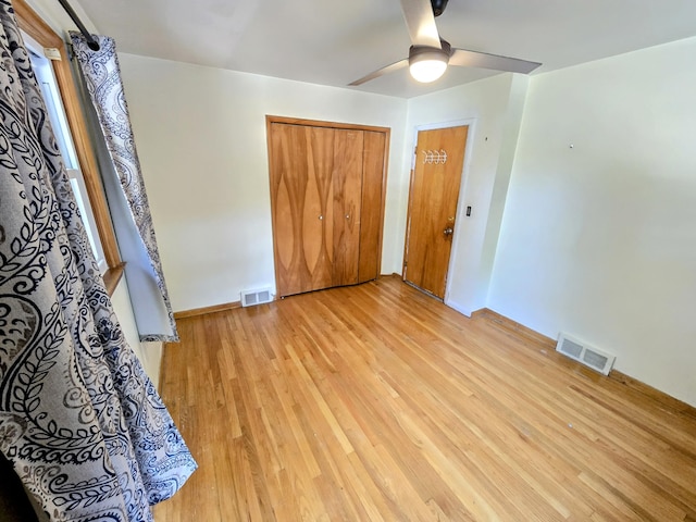 27751 Palomino Ave, Warren, MI 48093 - unfurnished bedroom with light wood-type flooring, a ceiling fan, and a closet