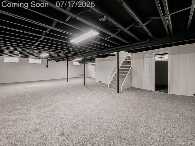 2314 Middlebelt Rd, West Bloomfield, MI 48324 - below grade area with stairway, healthy amount of natural light, and carpet flooring