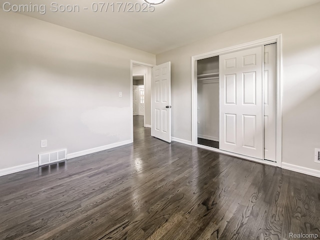 2314 Middlebelt Rd, West Bloomfield, MI 48324 - unfurnished bedroom featuring dark wood-style flooring and a closet