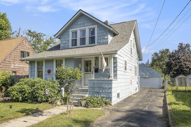 2136 Amherst Ave, Kalamazoo, MI 49008 - bungalow-style house with a porch, a chimney, an outdoor structure, a shingled roof, and a detached garage