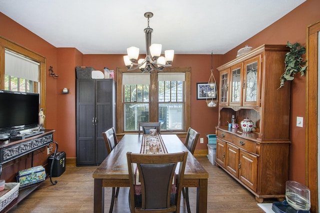 2136 Amherst Ave, Kalamazoo, MI 49008 - dining space featuring a chandelier and light wood-style floors